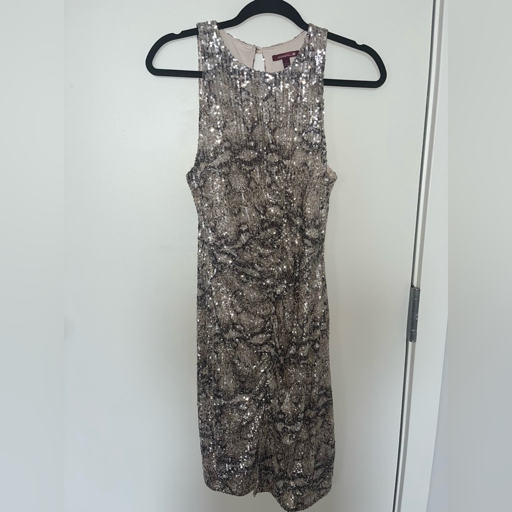 Sequenced dress with peekaboo keyhole​